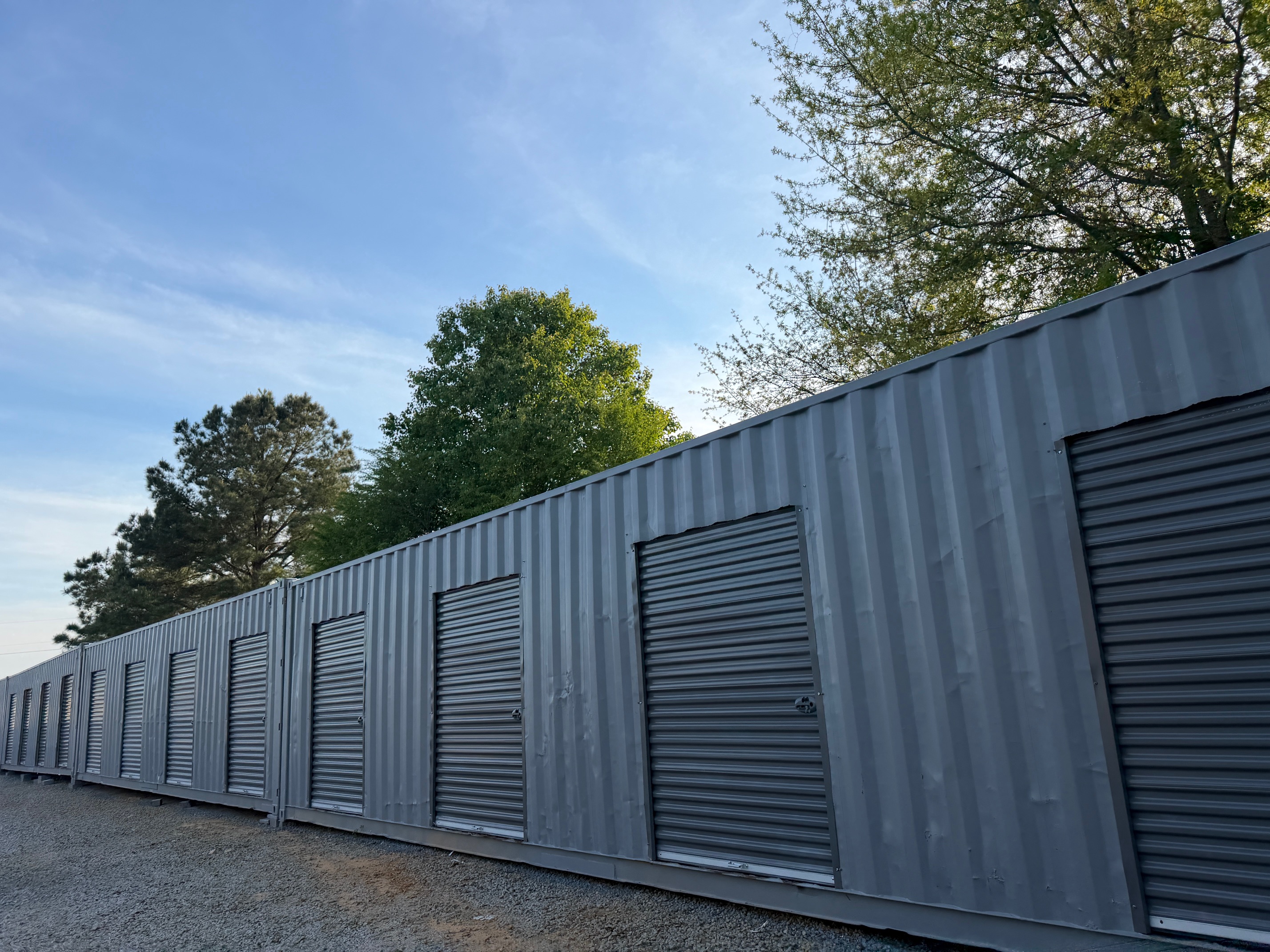 Secure roll-up doors on crate storage units at The Storage Yard At Northside in Berry Alabama