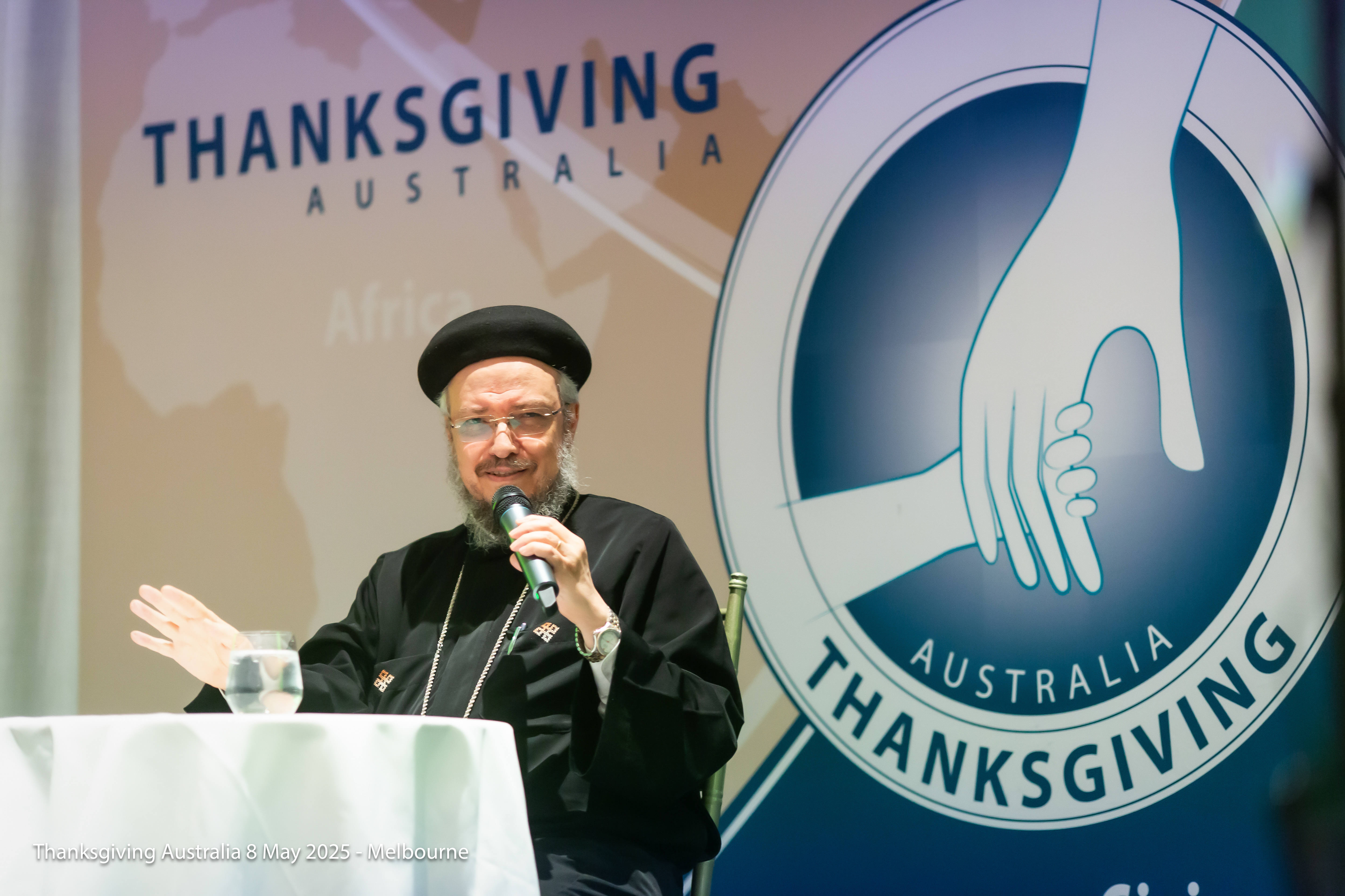 Father Daoud Lamei during a pastoral visit