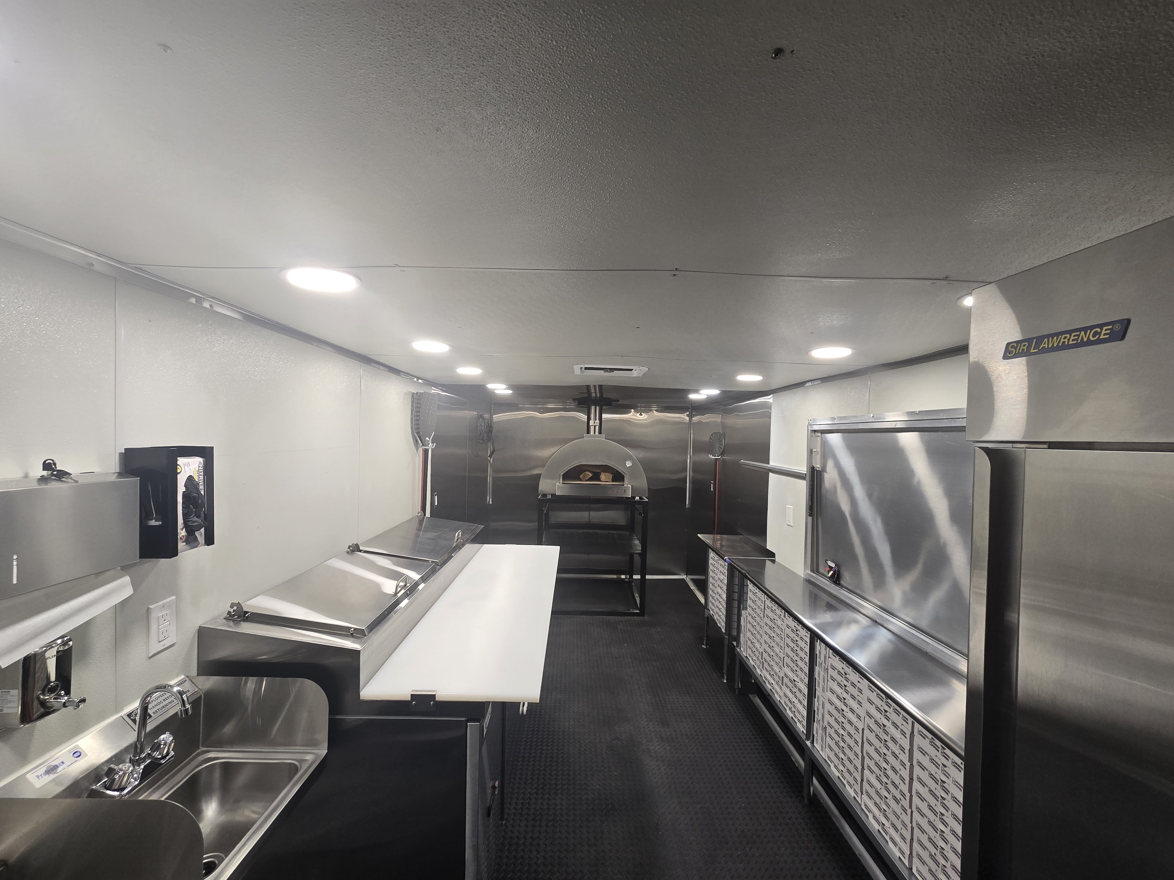 Palleschi Pizza Catering evening event with guests enjoying pizza