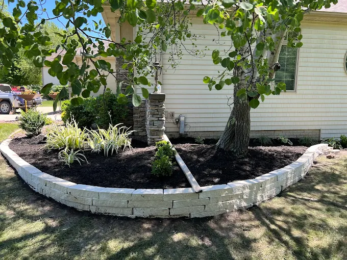 Professional landscaping team Des Moines Iowa Des Moines Landscaping LLC team at work on a retaining wall project