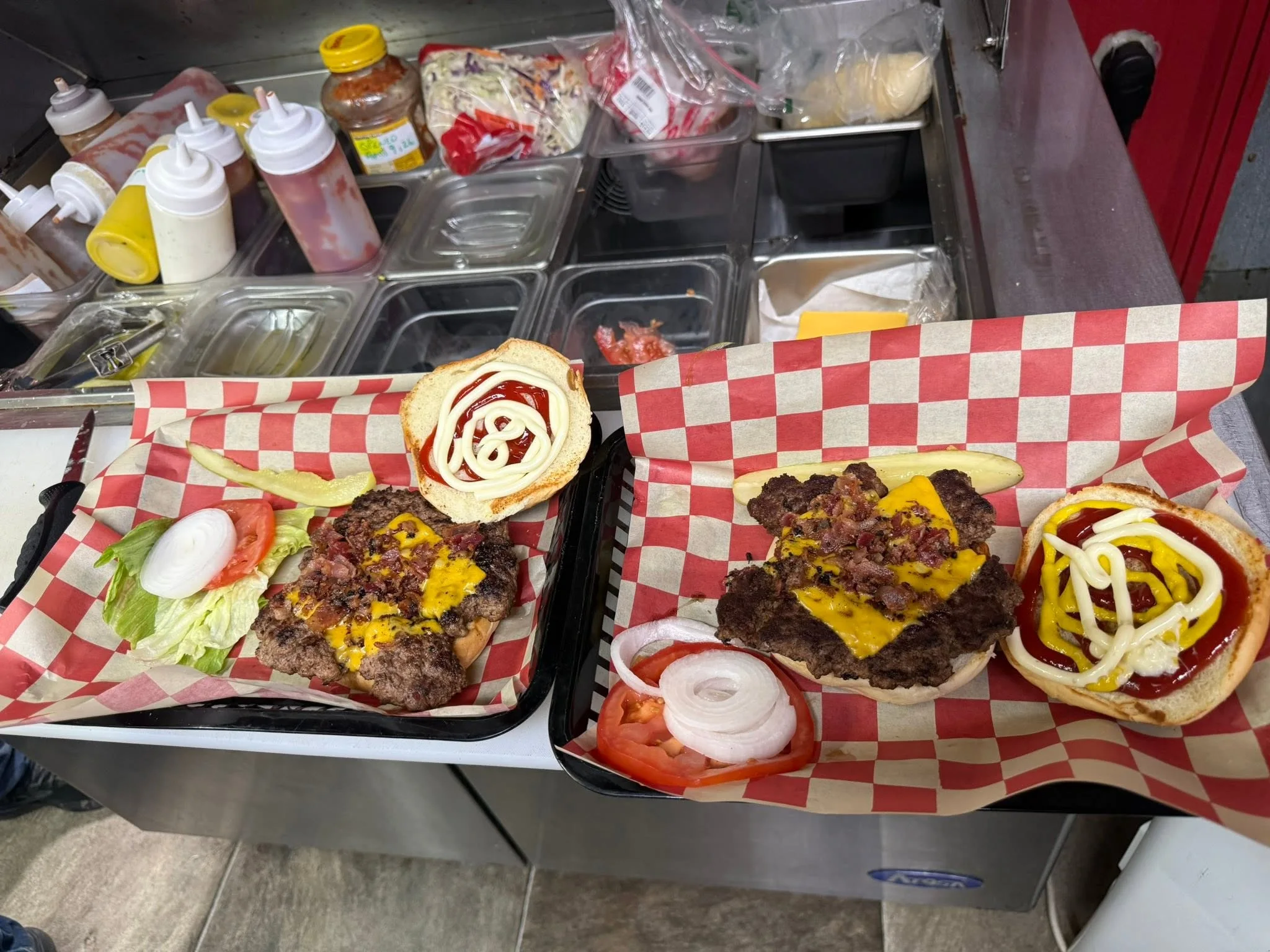 Farm fresh bacon cheeseburgers on the line at The Farm Bar & Grill
