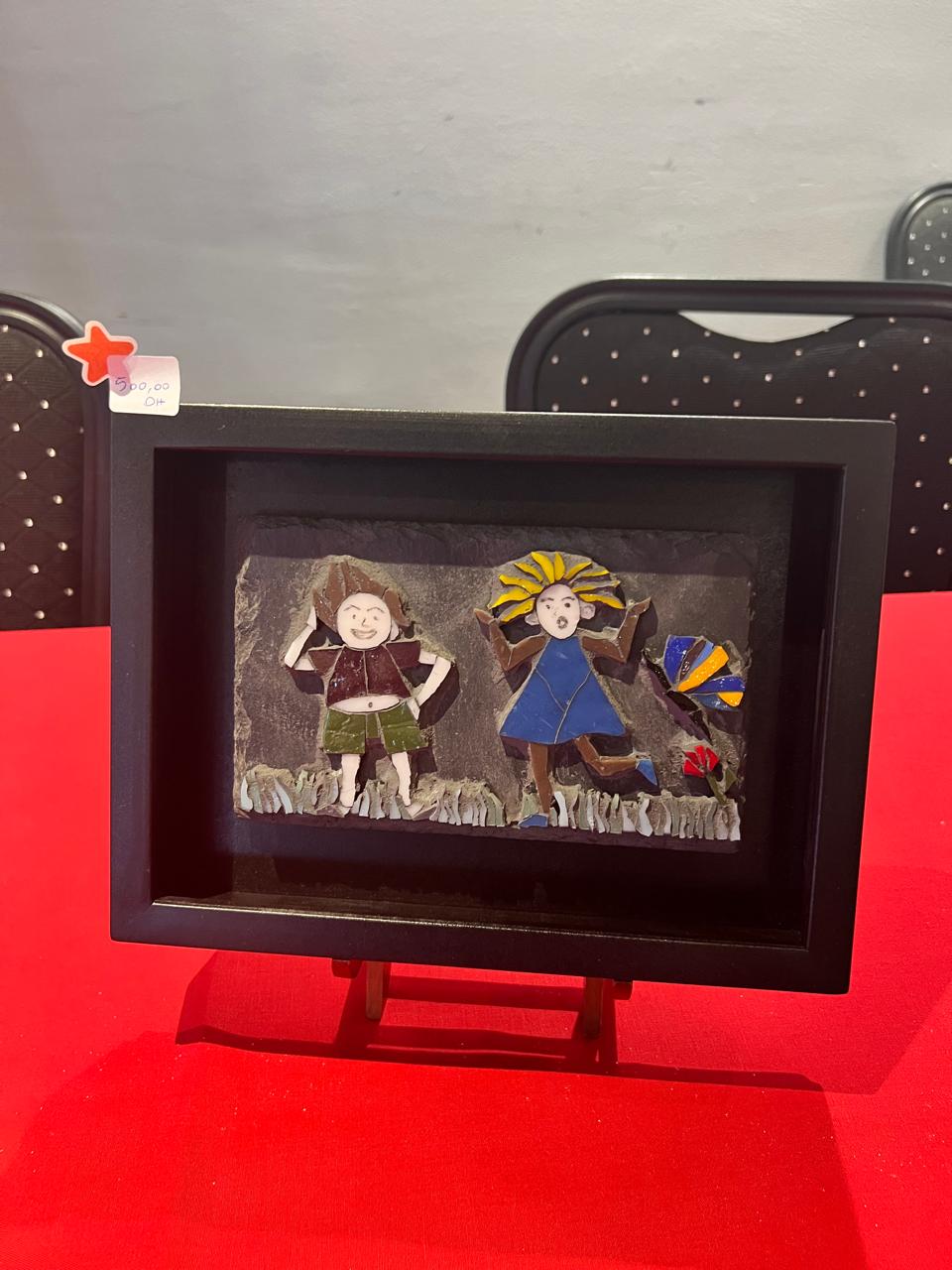 Mosaic wall sculpture blending mosaic and raw material with relief volumes