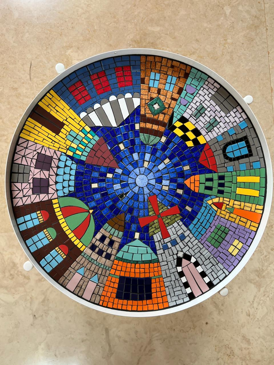 Calligraphic mosaic panel with blue Arabic letters on white background