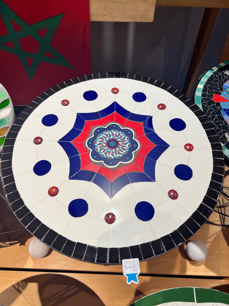 Mosaic decorative panel with interlaced star patterns in deep blue and ivory