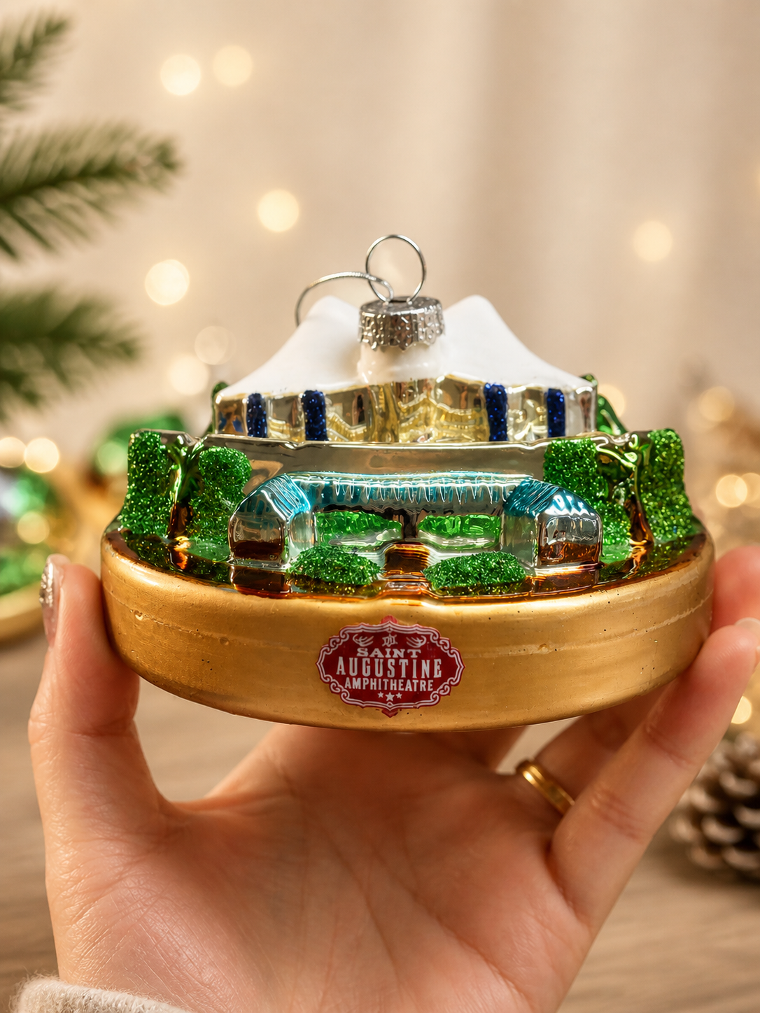 Custom glass ornament shaped like a famous amphitheatre landmark for destination souvenir gifting