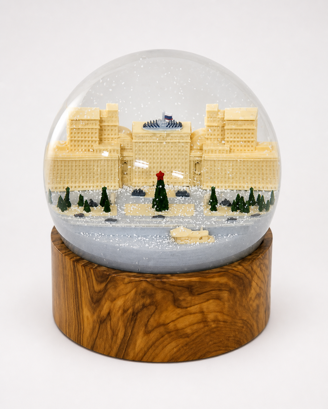 Custom city landmark snow globe showcasing a detailed architectural building with an ornate engraved base