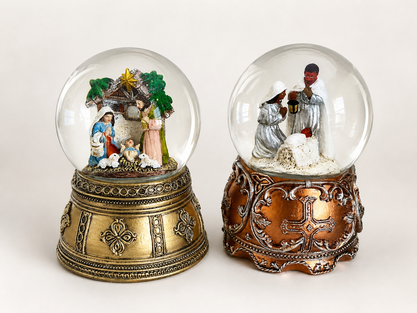 Custom nativity scene snow globe with hand-painted religious figures and a warm golden glow