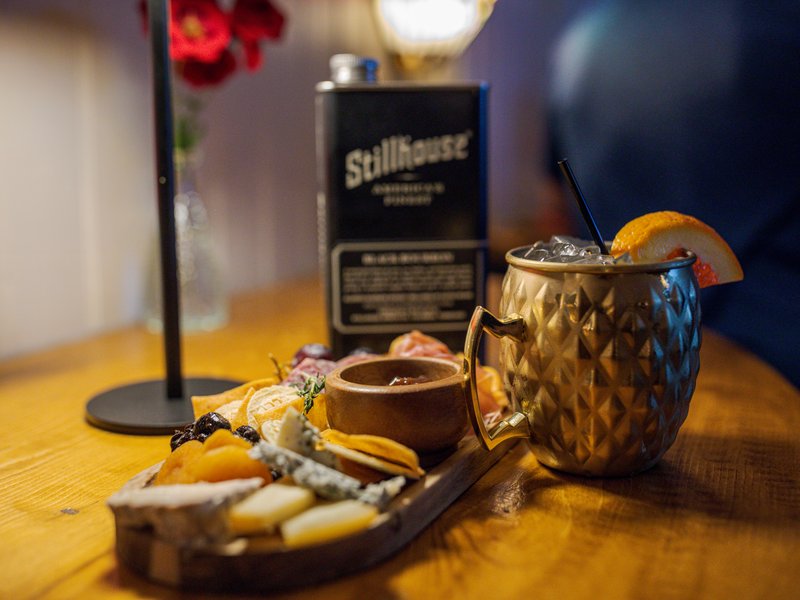 Artisanal charcuterie board and cocktail
