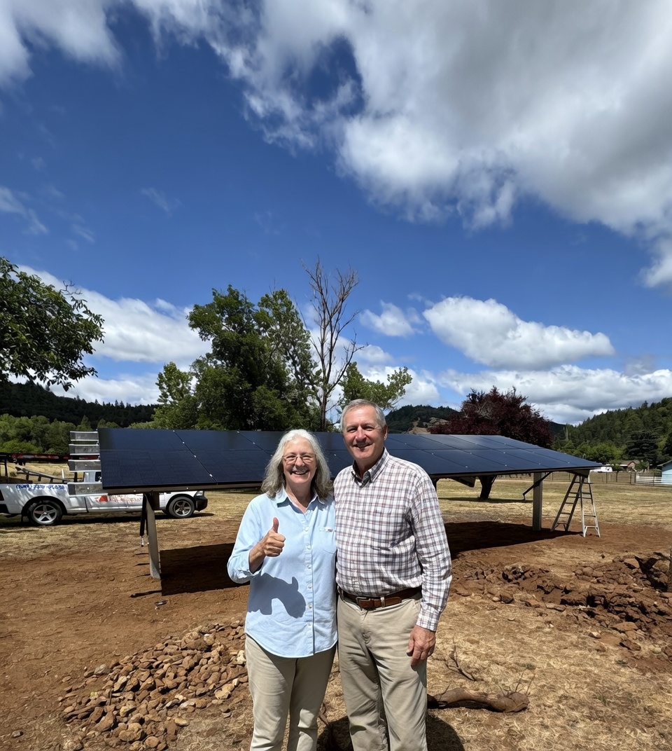 Happy customers with solar installation