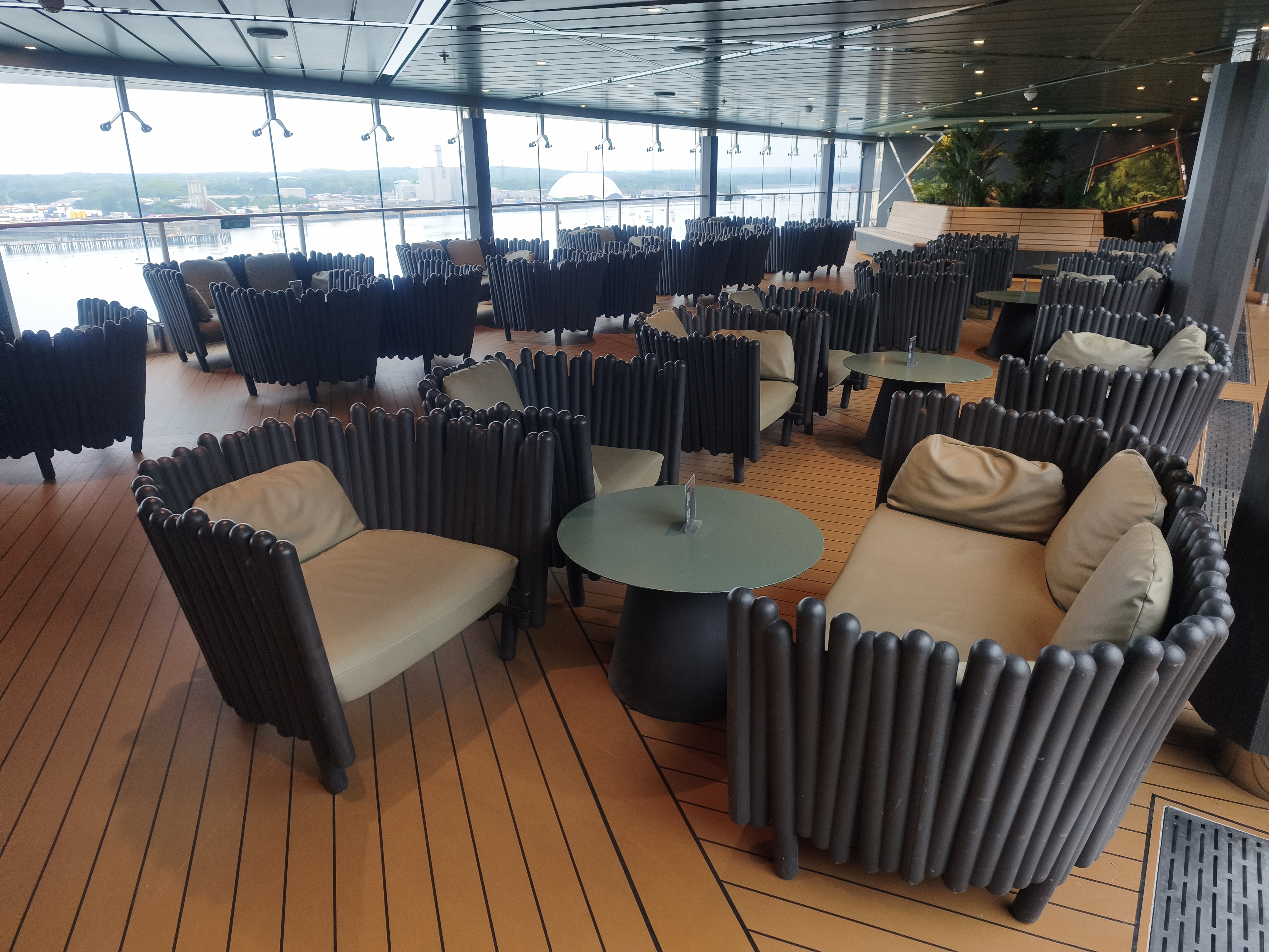 Cruise ship top deck overlooking calm blue ocean