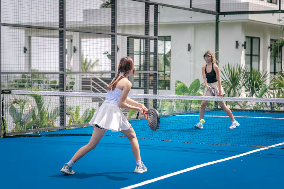 Padel players at luxury villa court