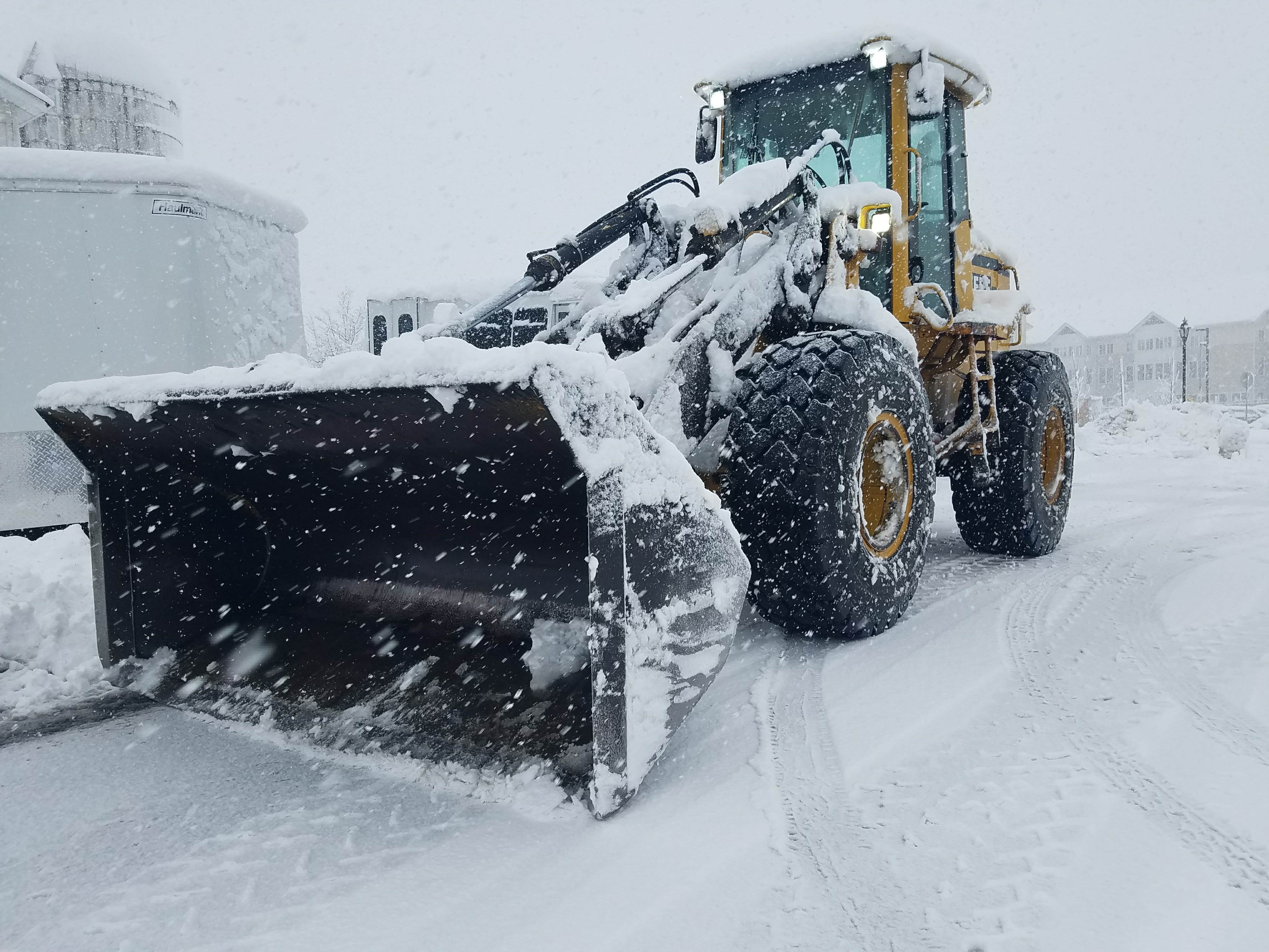 McCreesh Tree Service snow plowing a commercial parking lot